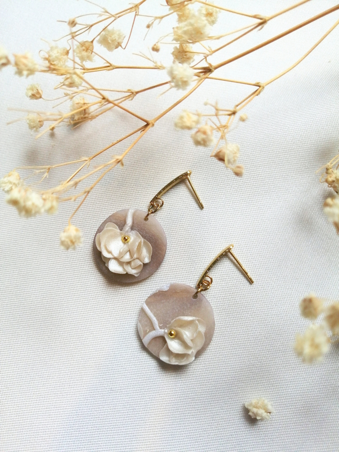 Boucles pastilles fleuries